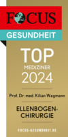 Focus Top Mediziner Siegel 2024 Ellenbogenchirurgie Prof. Dr. Kilian Wegmann, goldfarbenes Siegel mit weißer und schwarzer Schrift