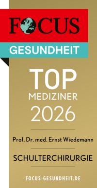 Focus Top Mediziner Siegel 2026 Schulterchirurgie Prof. Dr. med. Ernst Wiedemann, goldfarbenes Siegel mit weißer und schwarzer Schrift